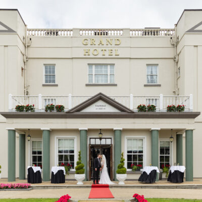 Couple outside the The Grand Hotel in Malahide Wedding with Coastal views